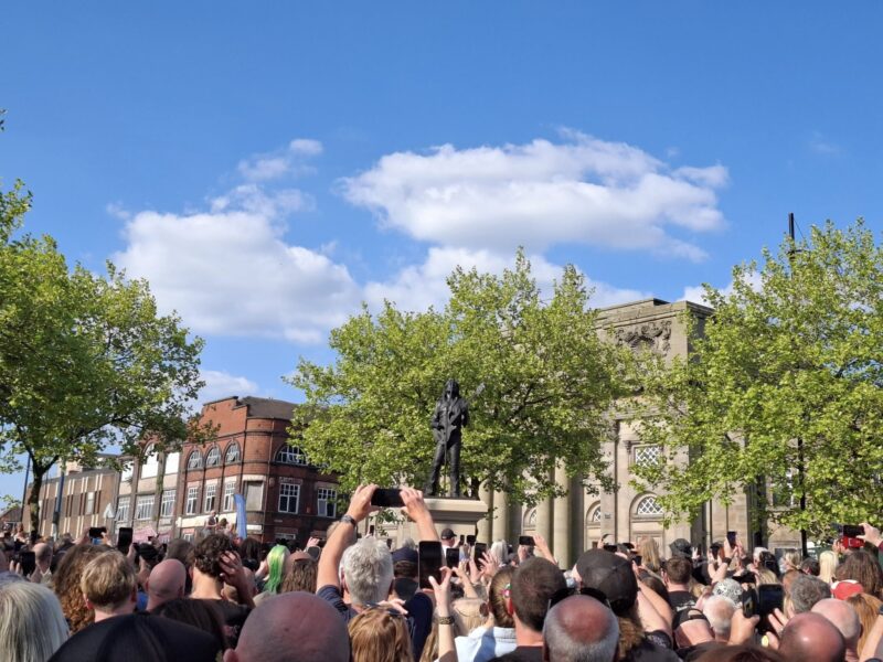 Lemmy statue with crowd